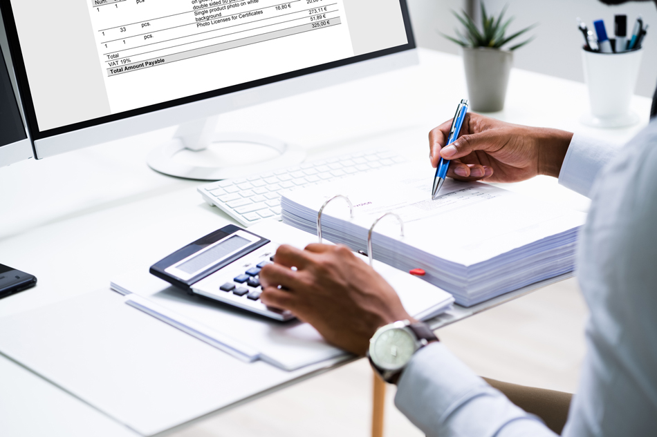 certified-public-accountant-calculating-finances-1276732089 Certified accountant calculating finances